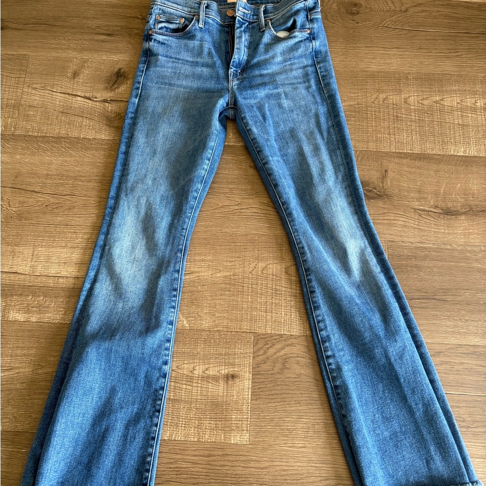 Mother jeans size 27 slight flare at the bottom.